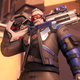 Soldier 76 poses with his rifle over his shoulder.